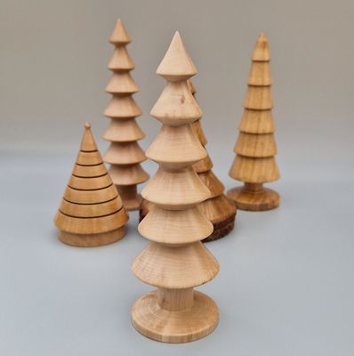 Hazel wood tree with six flared tiers and smooth base. Finished with Carnauba wax to impart a soft sheen and highlight grain.