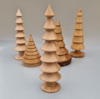 Hazel wood tree with seven tiers and textured trunk. Finished with Carnauba wax to impart a soft sheen.