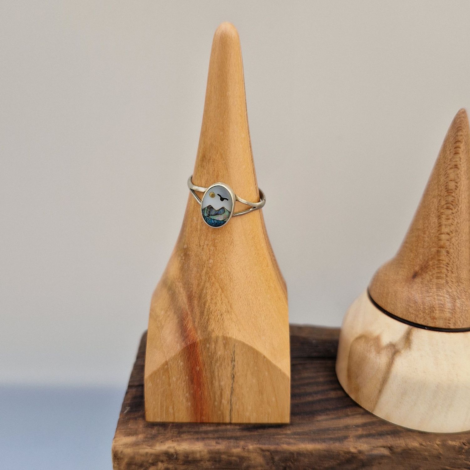 Plum ring holder with square base, finished with a soft sheen. Designed to hold rings upright on a bedside or dressing table.