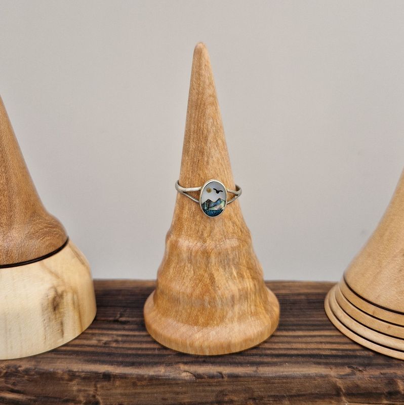 Ring holder with two delicate coves, turned from native Scottish wood. 