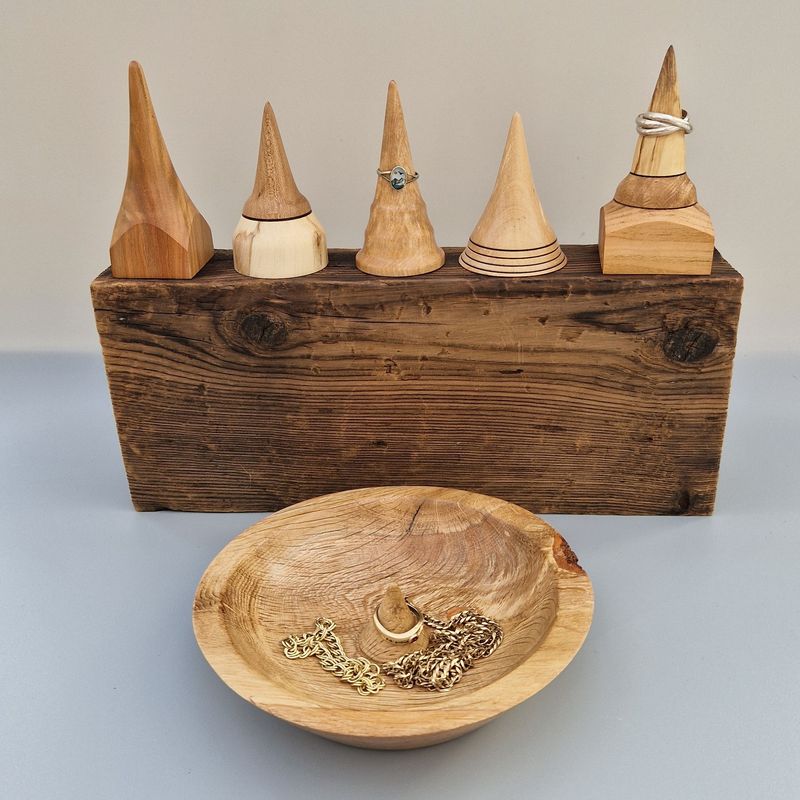 Oak Jewellery Dish Oak jewellery dish with cone-shaped ring holder and single peg wooden ring holders.