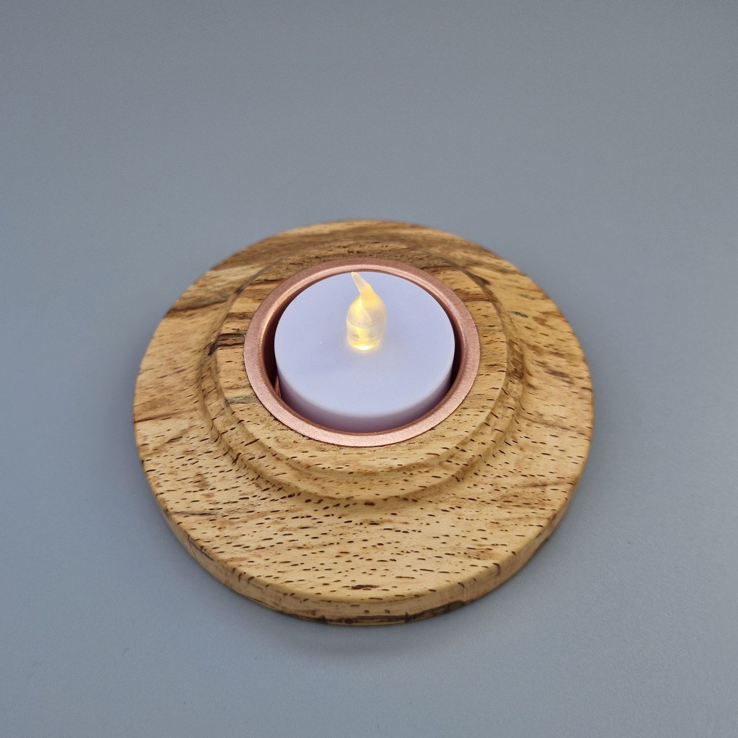 Wooden Tealight Holder - Spalted Beech Flat tealight holder in spalted beech with copper insert; low profile and warm grain.