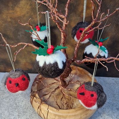 Needle-felted woollen baubles, Christmas Puddings and Robins hanging from a copper-wire tree.