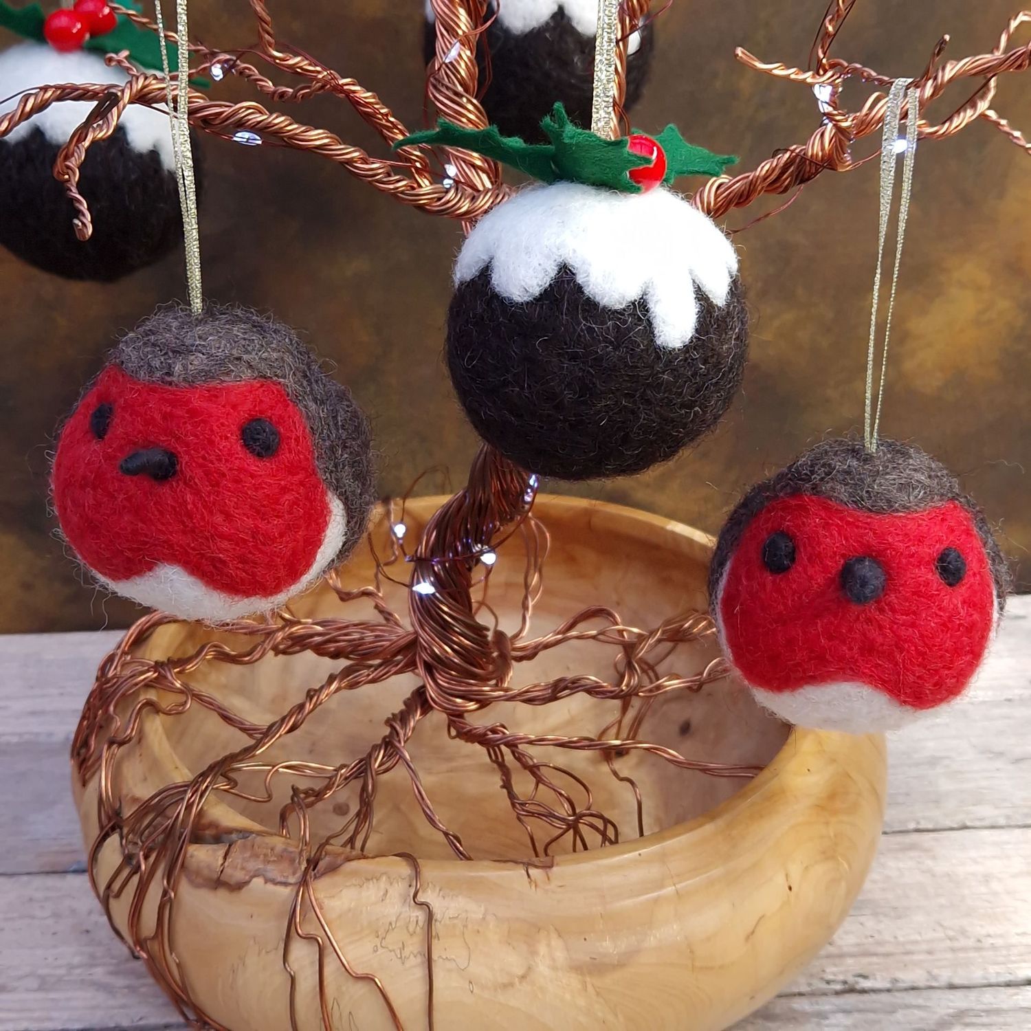 Christmas Robin Baubles Needle-felted robin bauble with red breast and glittery ribbon hanger.