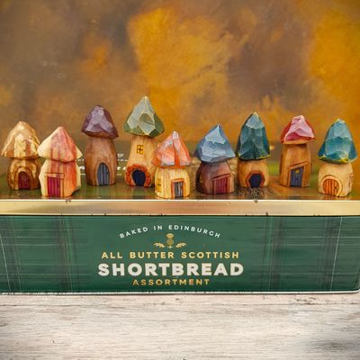  Handcarved wooden miniature mushroom house ornaments with painted roofs and doors.