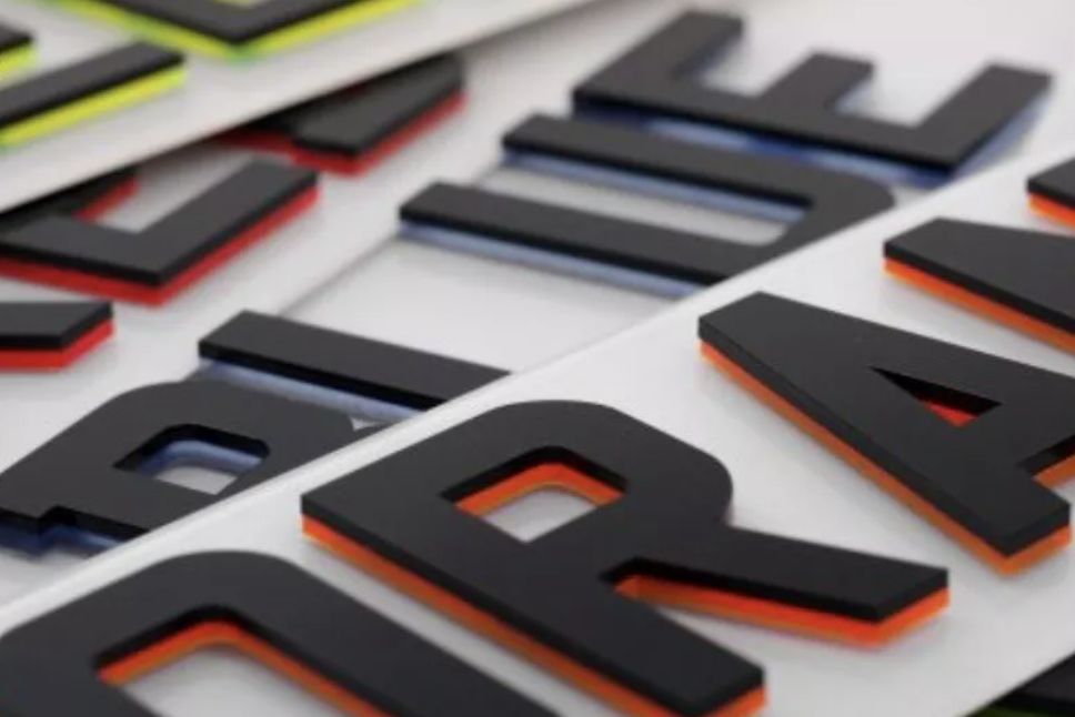 Colour backed letter show number plates