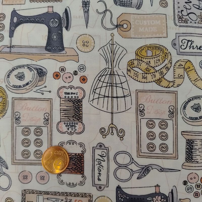 Tela beige con motivos de costura