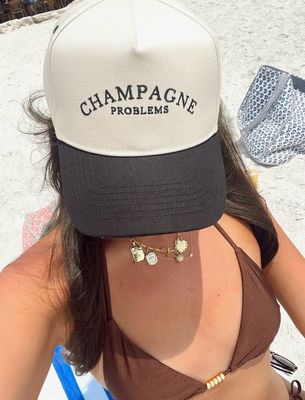 Champagne Problems Trucker Hat