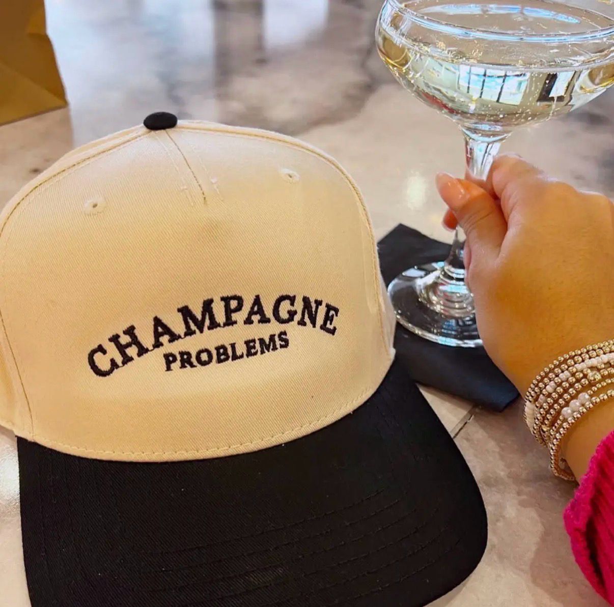 Champagne Problems Trucker Hat