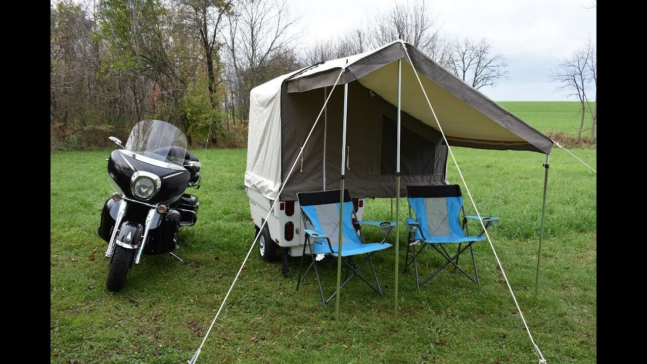 Motorcycle camper with bathroom outlet