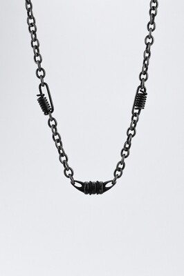 Blackened anchor chain with decorative knots