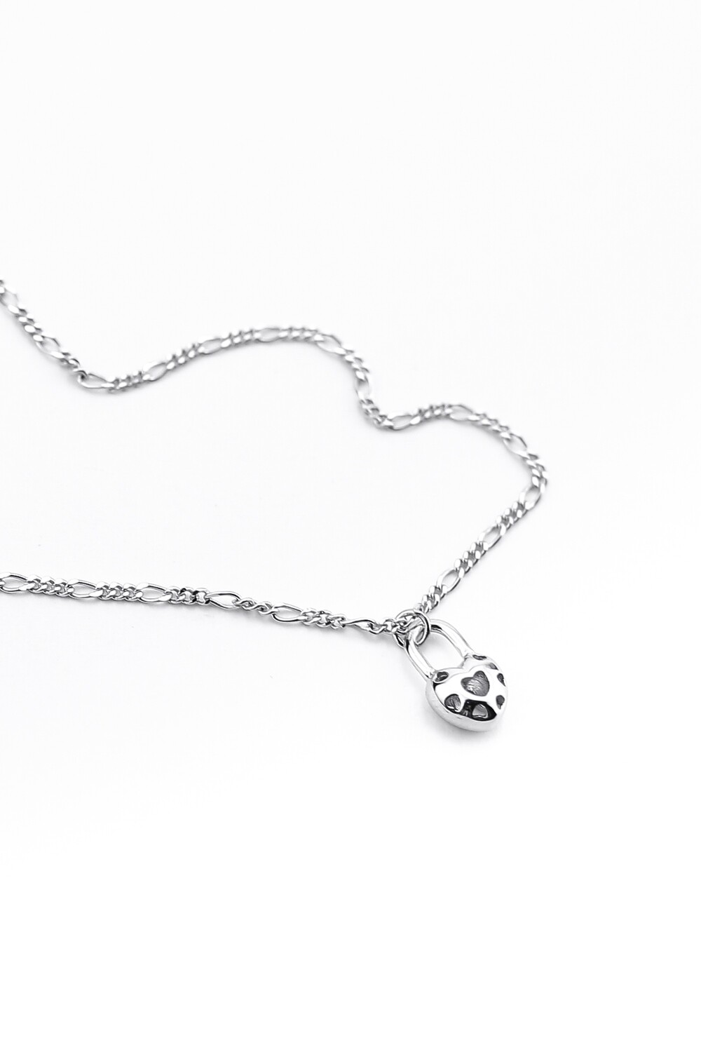 "Heart-lock" pendant on a thin Figaro chain