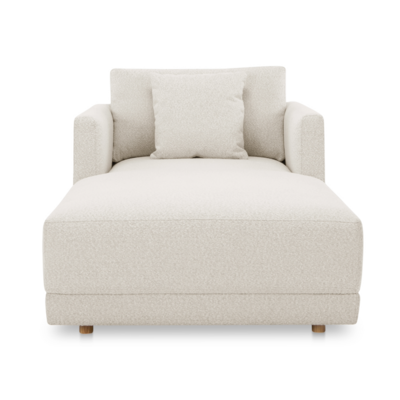 A modern chaise chair, 39.5” W X 77.0” D X 31.5” H, upholstered in a off white boucle fabric.