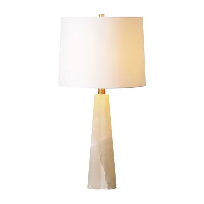 A European flair fills the contemporary interior through this table lamp design. With a sleek and luxurious onyx body and a bright, off-white shade, this table lamp feels like a work of art in the living room interior. You'll appreciate this dichotomy of this piece's cool quality during the day and warmth at night.