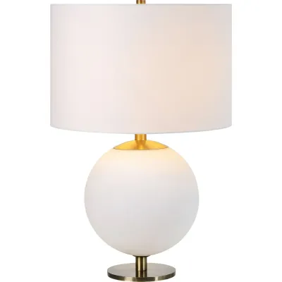 Architecture meets artistry in this lamp design. Whether placed in a bedroom or living room, it offers a welcoming quality to the space. The etched white iron base, antique brass details and off-white cotton shade form a fashionable trifecta, with each element complementing the other in shade and structure.