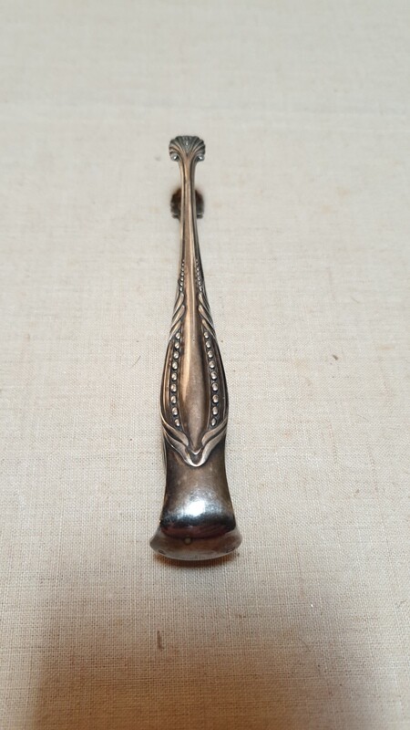 Pince à sucre avec prise en forme de coquillage  L-14cm