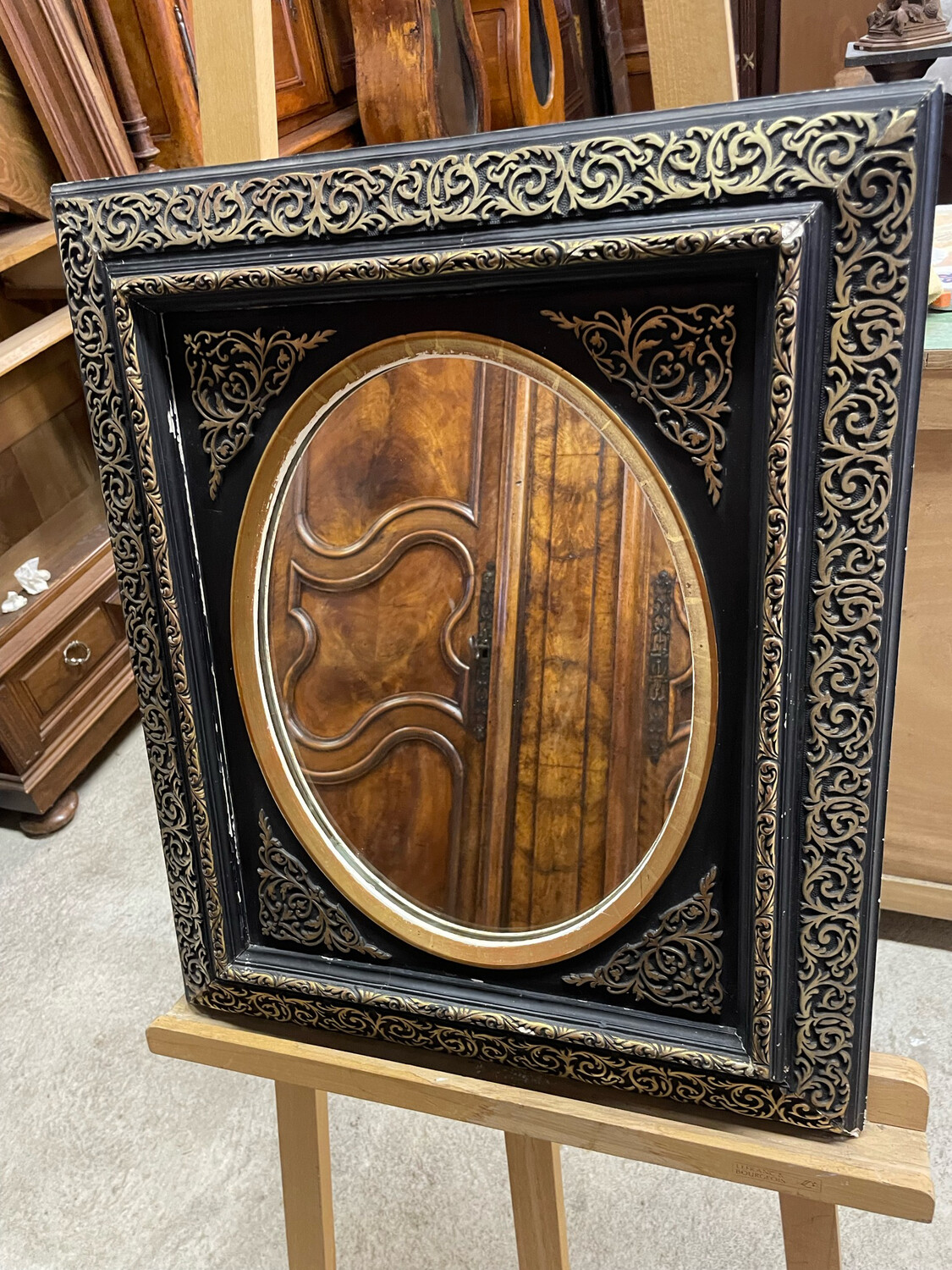 Miroir oval à cadre en bois et stuc doré noir et or - dimension totale : 63 x 53 cm