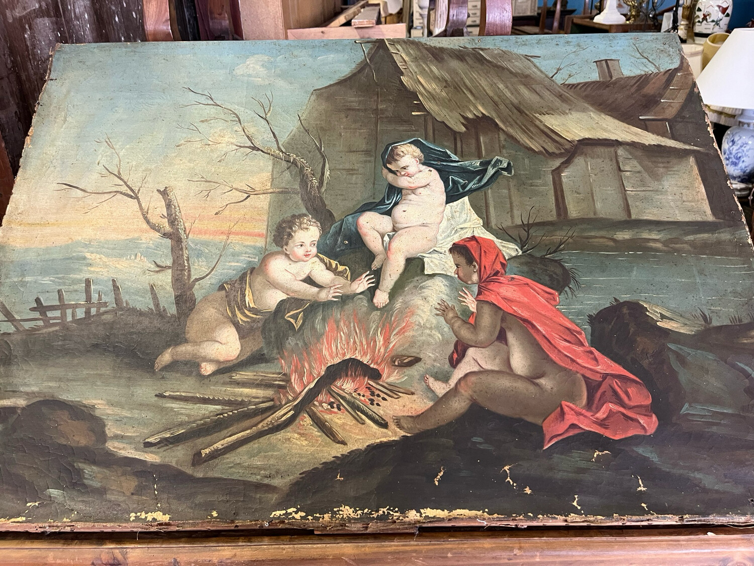 École française vers 1800. Amours autour d’un feu ou allégorie de l’hiver. Huile sur toile - 100 x 72 cm manque de matière en bordure