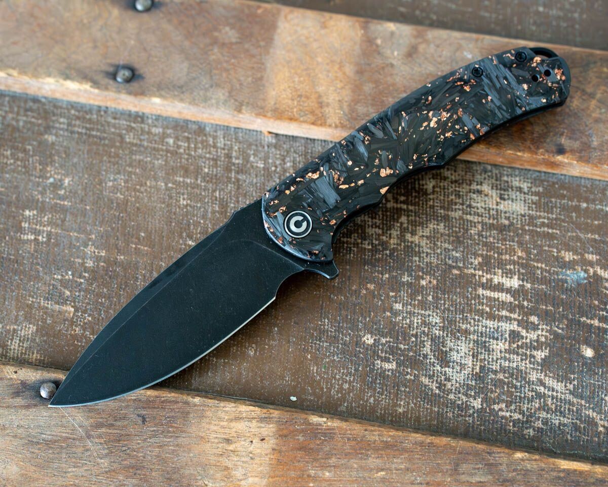 Civivi Knives Praxis Flipper Knife Shredded carbon fiber and copper shred in clear resin handle.