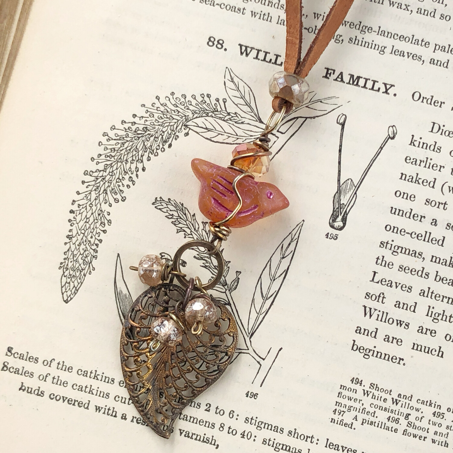 Bright Orange Bird and Filigree Leaf on Leather Lace