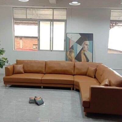 Leather L shape sofa in tan colour