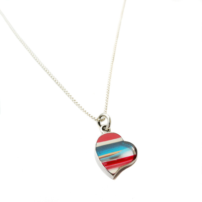 Upcycled surfboard resin heart charm with red, white, blue and clear.