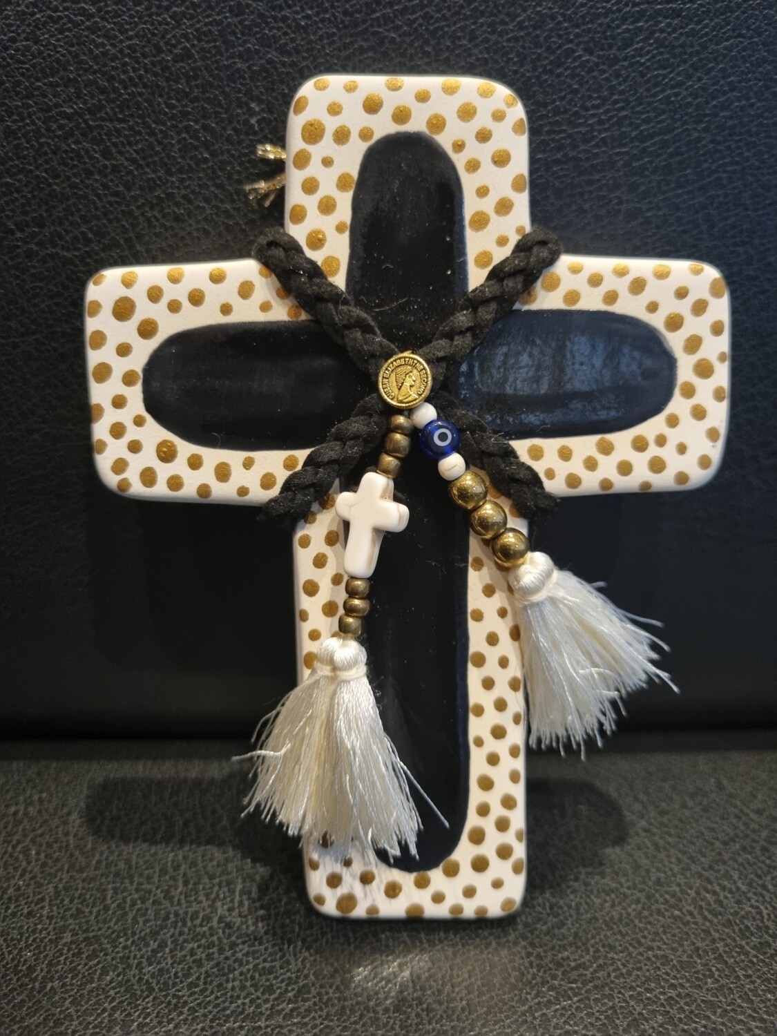 Small black and gold spotted ceramic cross