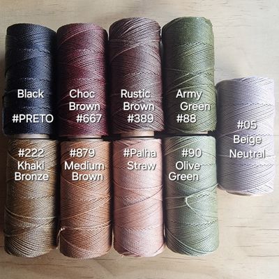 Spools of thick 1.5mm Linhasita waxed cord in bold colours, ideal for chunky macramé jewelry and high-impact fiber crafts.