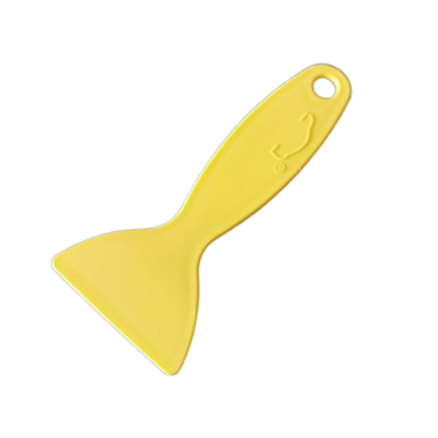 Espátula o paleta para esparcir pegamento de cueros.
