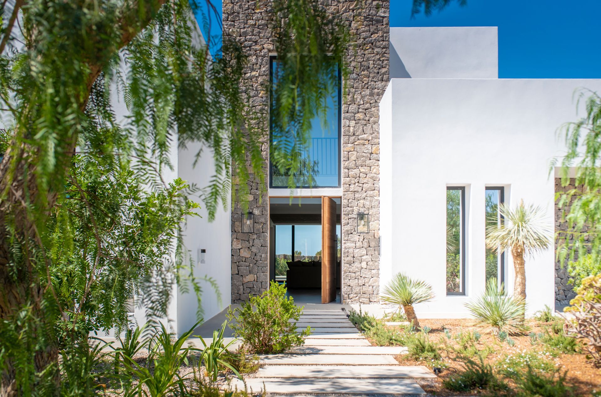 Premium Villa with natural materials, flowing spaces, thick walls, solid doors, all in modern design and with sea view.