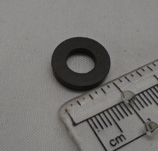 Spacer for silencer protection fixing
