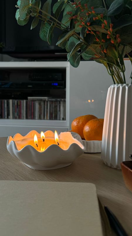 Scented candle in a shell-shaped plaster shell