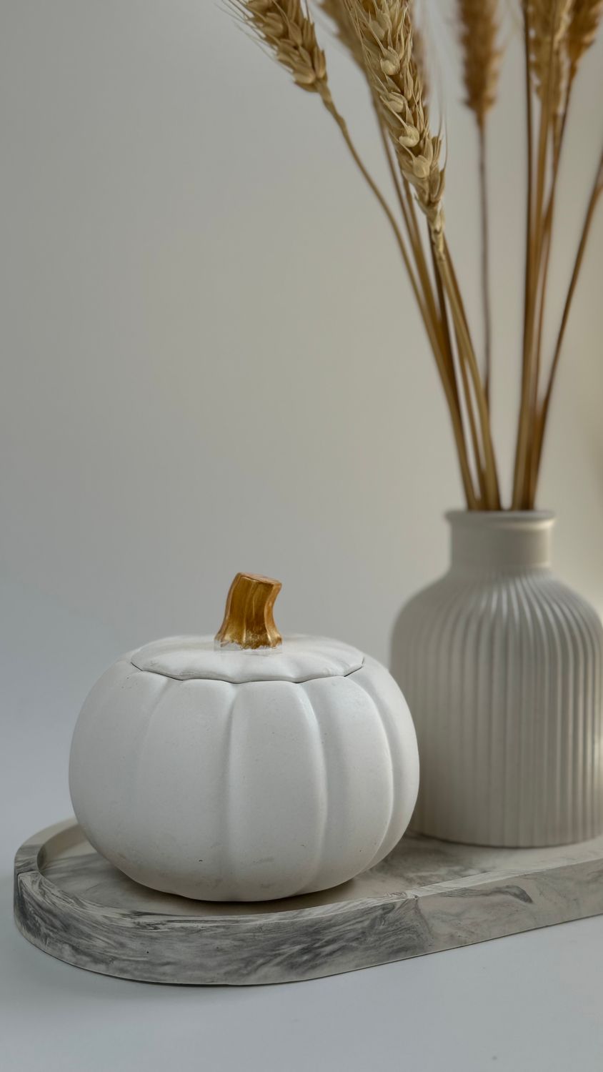 Set with pumpkin. Vase for dried flowers and candle on an oval stand
