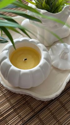Scented candle in a pumpkin candlestick