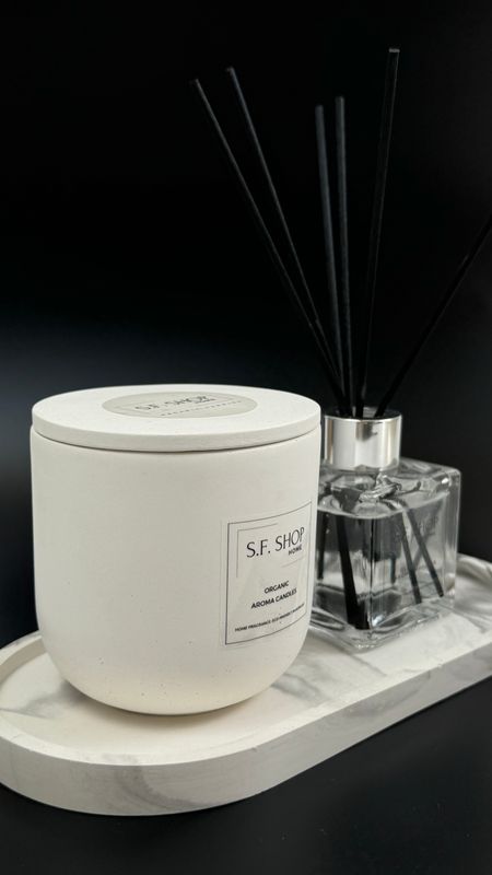 Large scented candle in a plaster candlestick with a lid