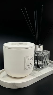 Large scented candle in a plaster candlestick with a lid