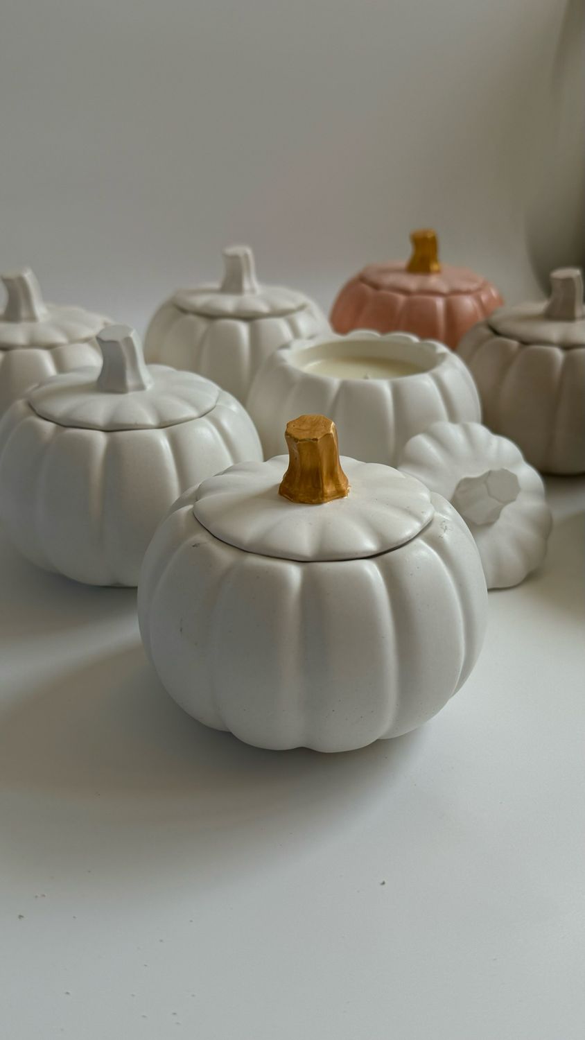 Scented candle in a pumpkin candlestick