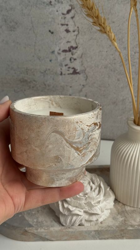 Aroma candle in a plaster glass on a leg