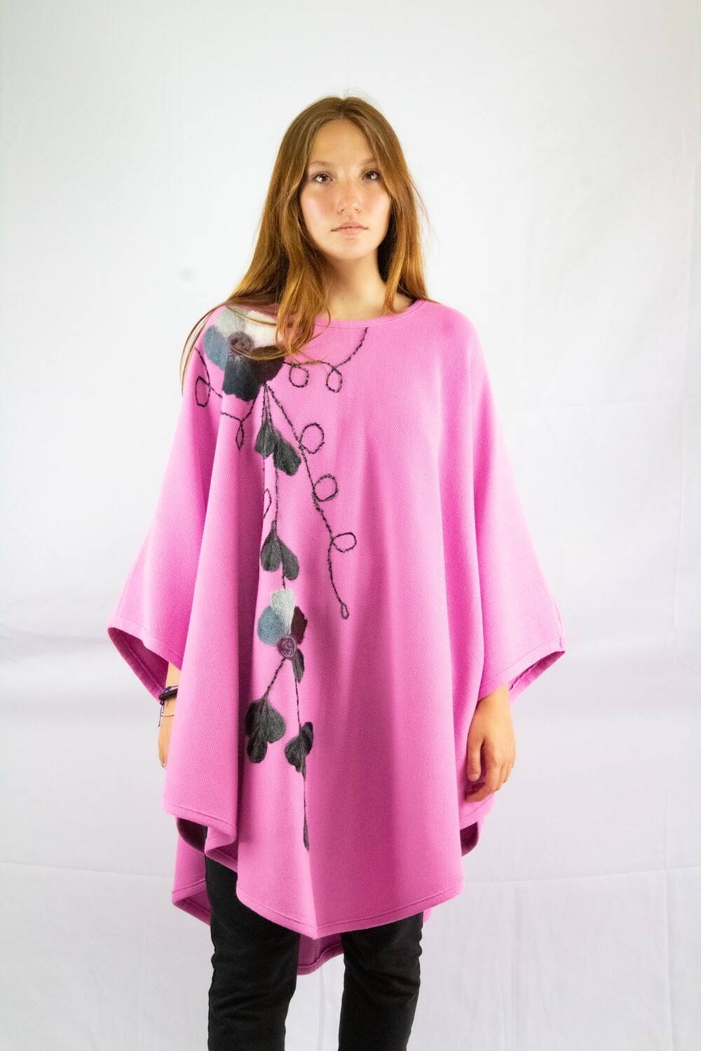Pink poncho with floral design 