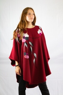 Red poncho with floral design 