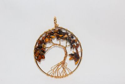 DIJE DE ARBOL CON OJO DE TIGRE