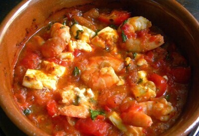 Scampi alla calabrese: nduja, tomates cerises, accompagnés de riz et légumes