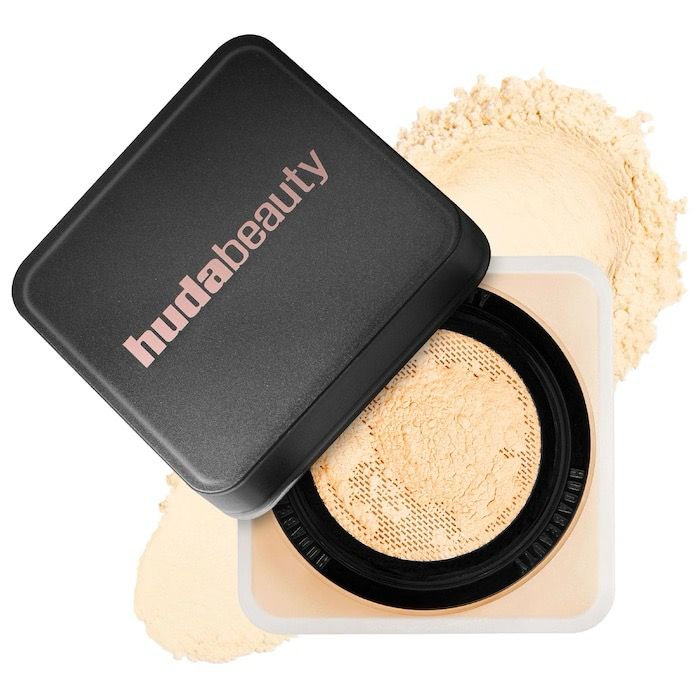 Huda Beauty - Easy Bake Loose Setting Powder | Banana Bread - light, medium, and tan skin tones. golden undertones brighten and disguise under-eye darkness.