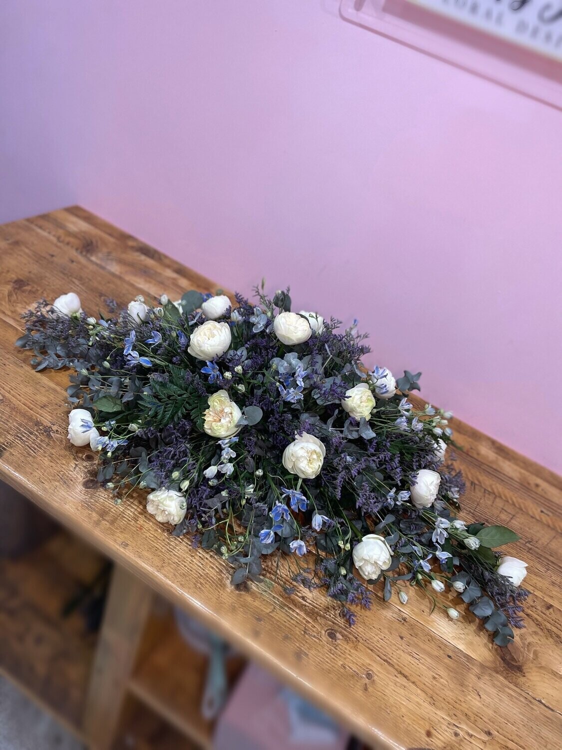 White, Purple & Blue Casket Spray Funeral Tribute