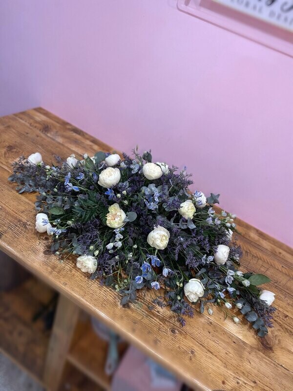 White, Purple & Blue Casket Spray Funeral Tribute