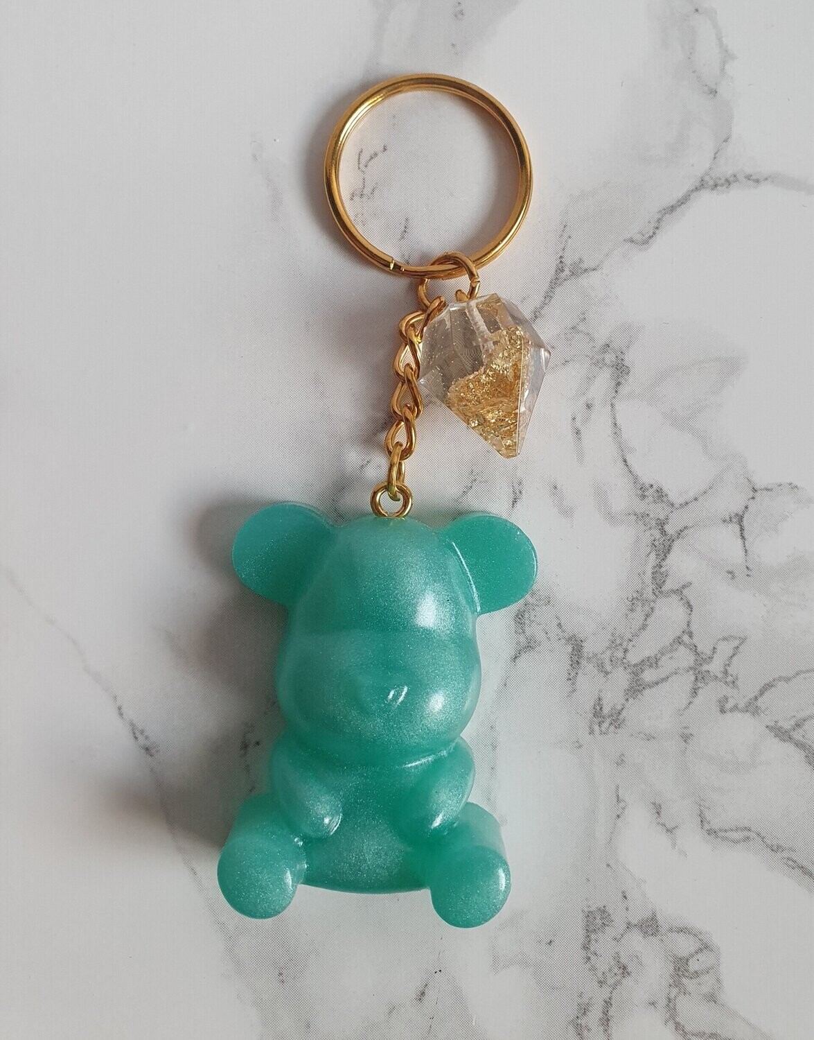 Porte clé moyen ourson vert émeraude et diamant feuilles d'or