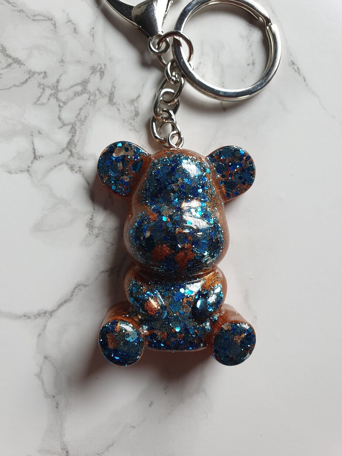 Porte clé maxi ourson bronze à paillettes bleues