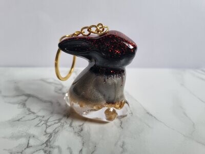 Porte clé Lapinou noir paillettes rouges et feuilles d'or