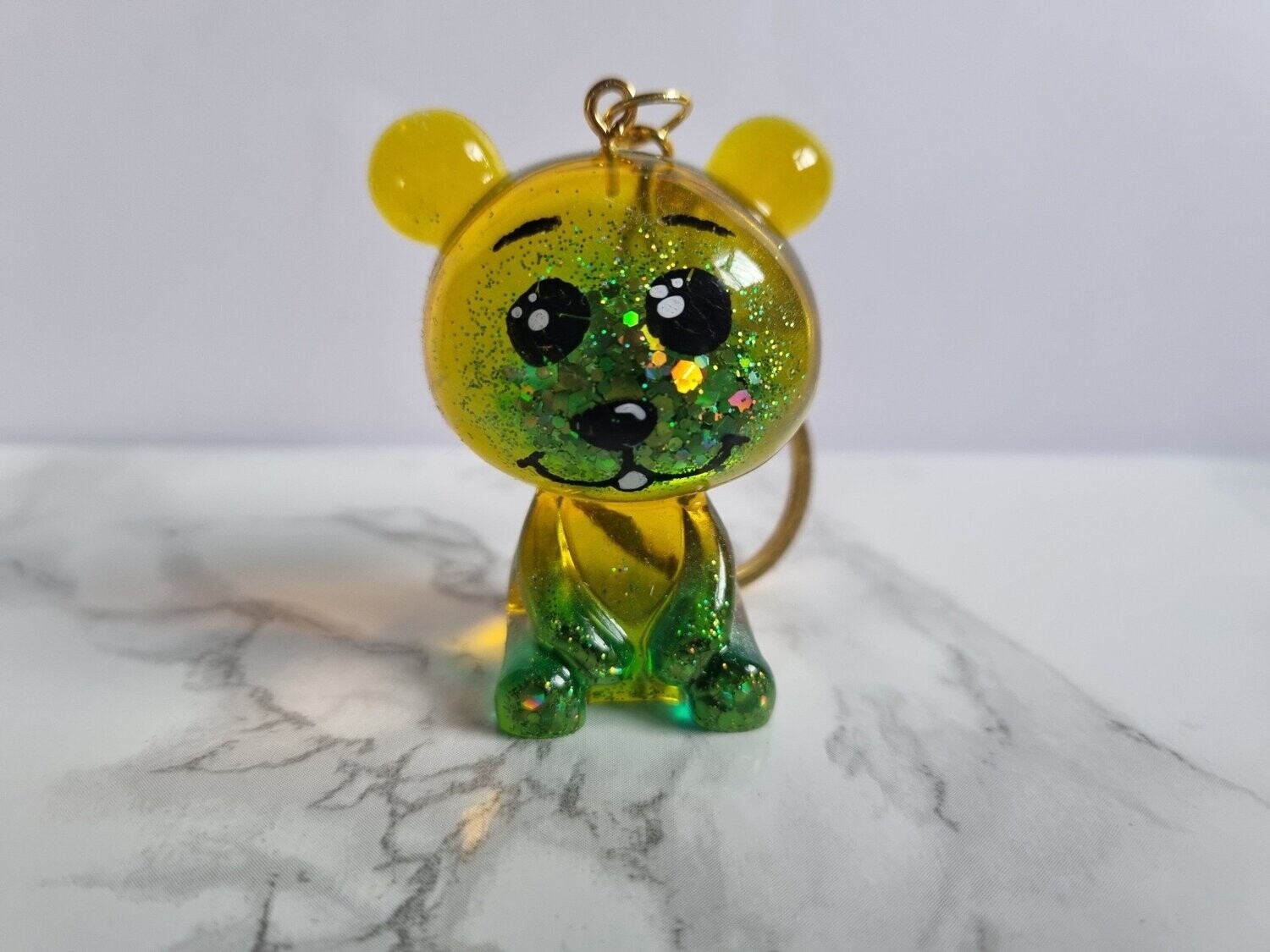 Porte clé Zanimos Ourson jaune et vert à paillettes