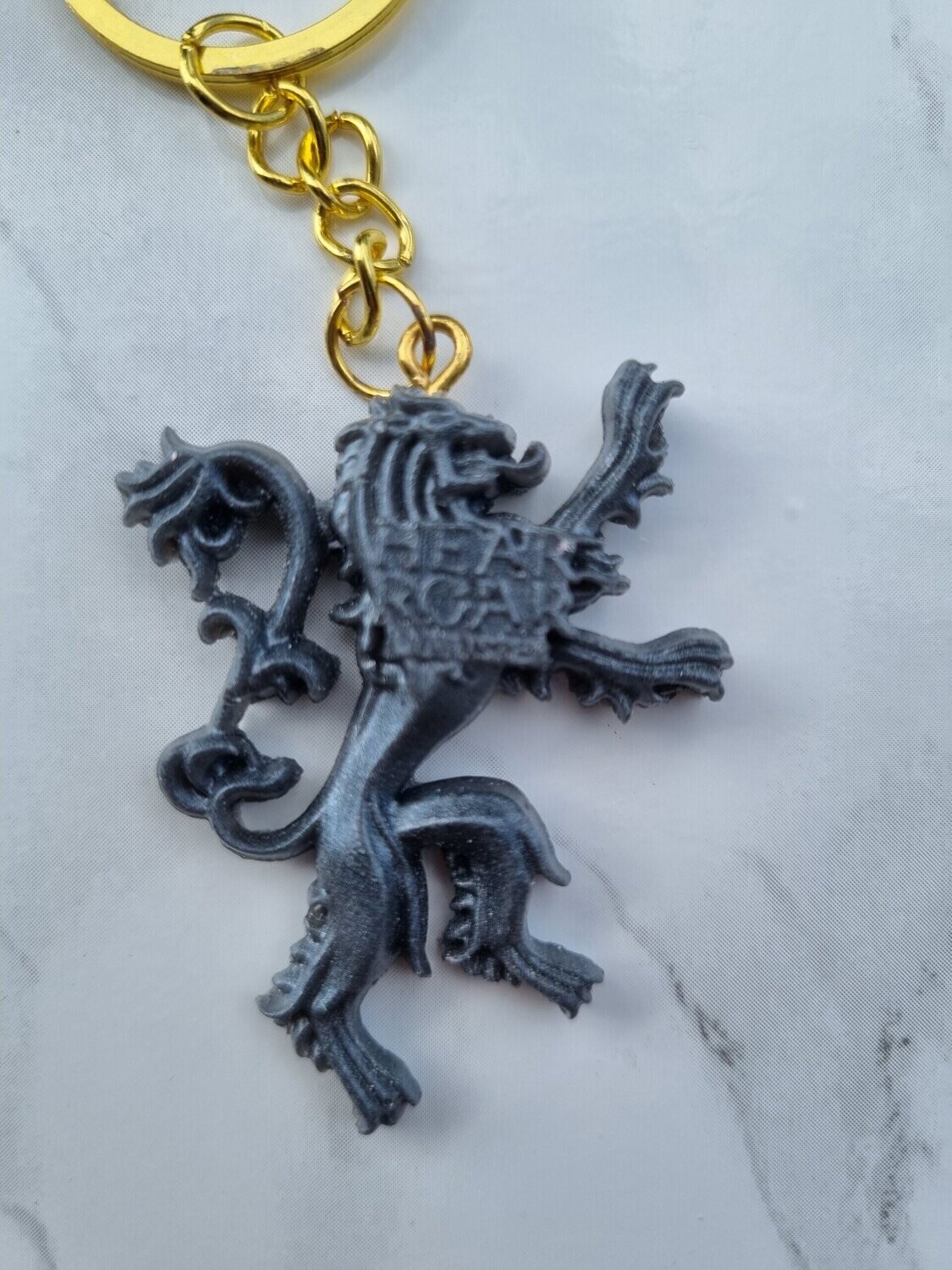Porte clé GOT Lanister anthracite